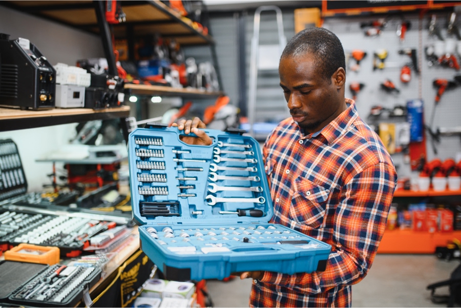 man-buyer-chooses-a-toolbox-in-a-store.jpg